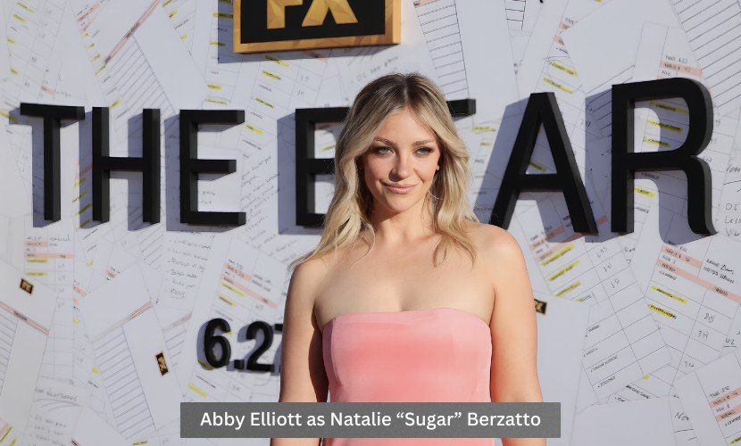 Abby Elliott poses on the red carpet at The Bear premiere event as Natalie “Sugar” Berzatto.