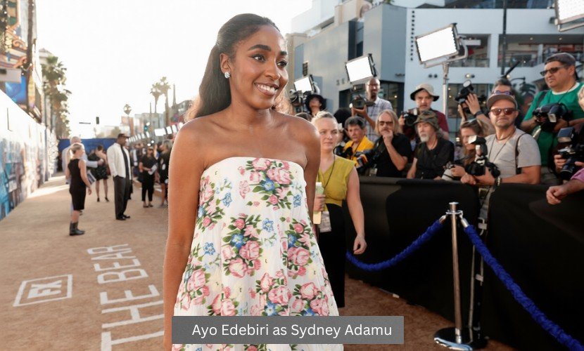 Ayo Edebiri arrives at The Bear premiere event wearing a floral dress as Sydney Adamu.
